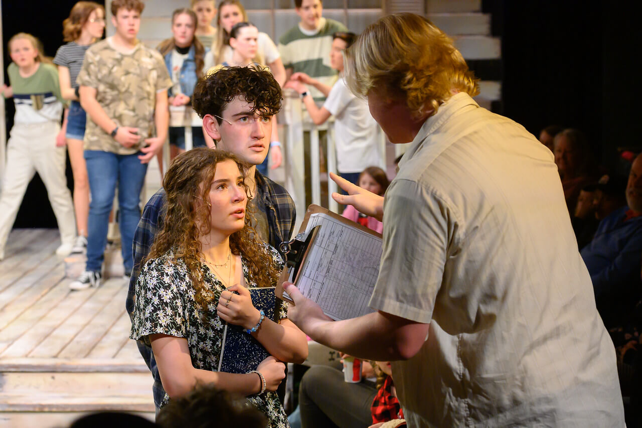 Camp Rock campers, rallied together by their camp counselor 